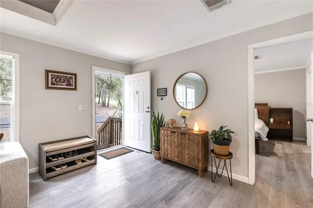 a bedroom with a bed and a mirror