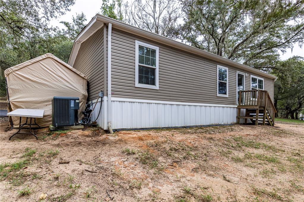 10135 North Em En El Grove Road Leesburg, FL 34788 - Photo 31 of 54 a view of a house with a yard