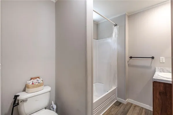 a bedroom with a bed closet and window