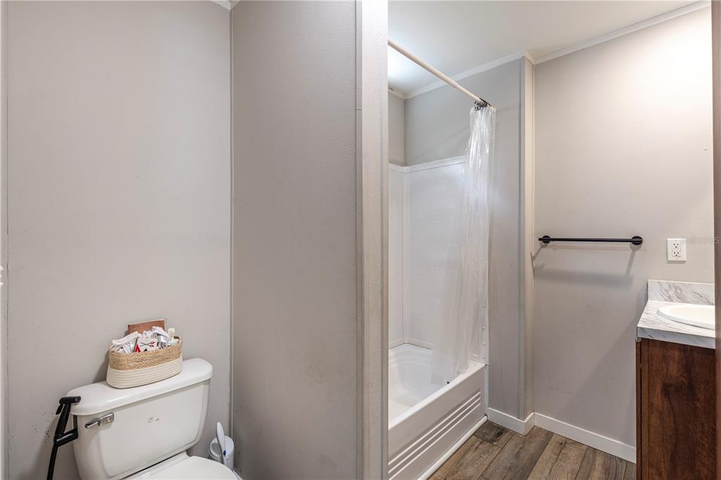 10135 North Em En El Grove Road Leesburg, FL 34788 - Photo 43 of 54 a bathroom with a toilet and a shower