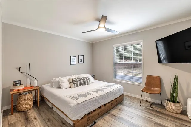 a bedroom with a bed closet and window