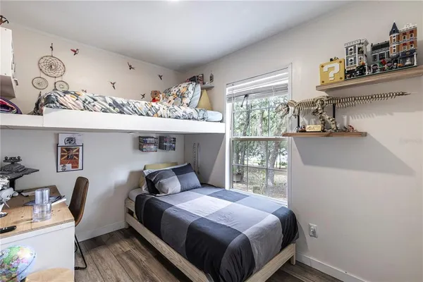 an aerial view of field with beach