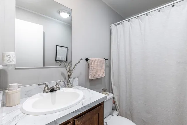 an aerial view of field with beach