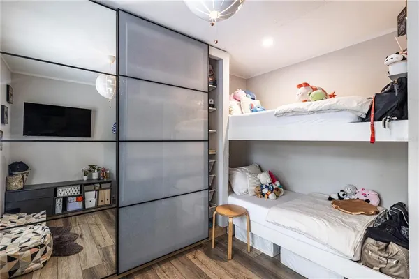 an aerial view of residential house with outdoor space and trees all around