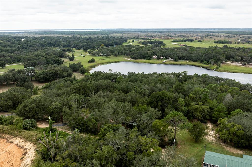 10135 North Em En El Grove Road Leesburg, FL 34788 - Photo 49 of 54 an aerial view of field with beach