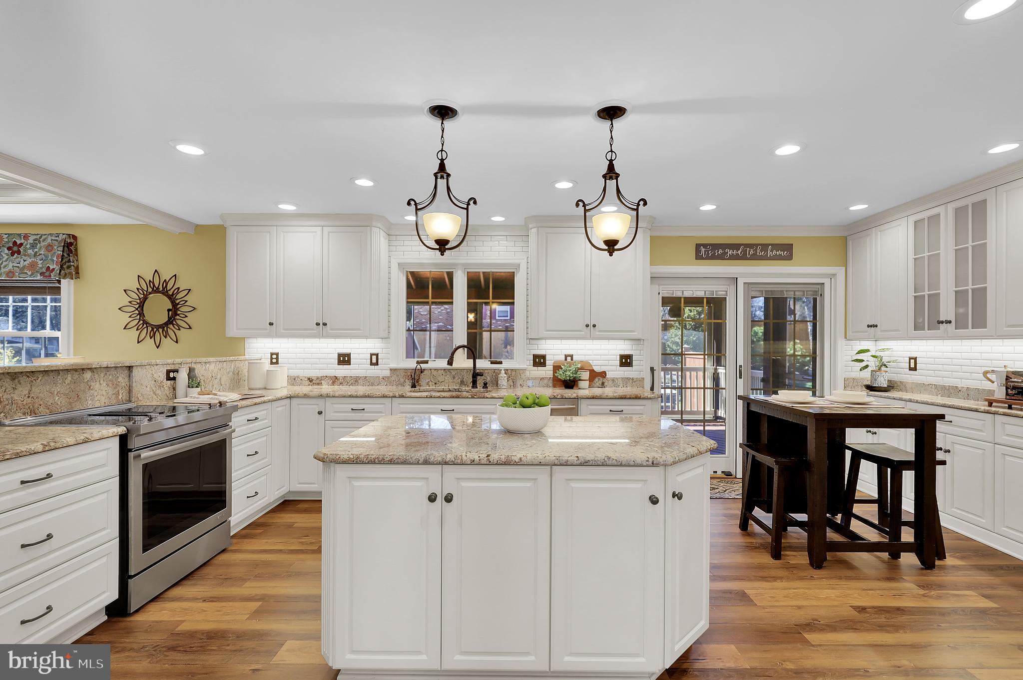 7908 River Run Court Frederick, MD 21701 - Photo 11 of 59 a kitchen with stainless steel appliances granite countertop a sink and stove