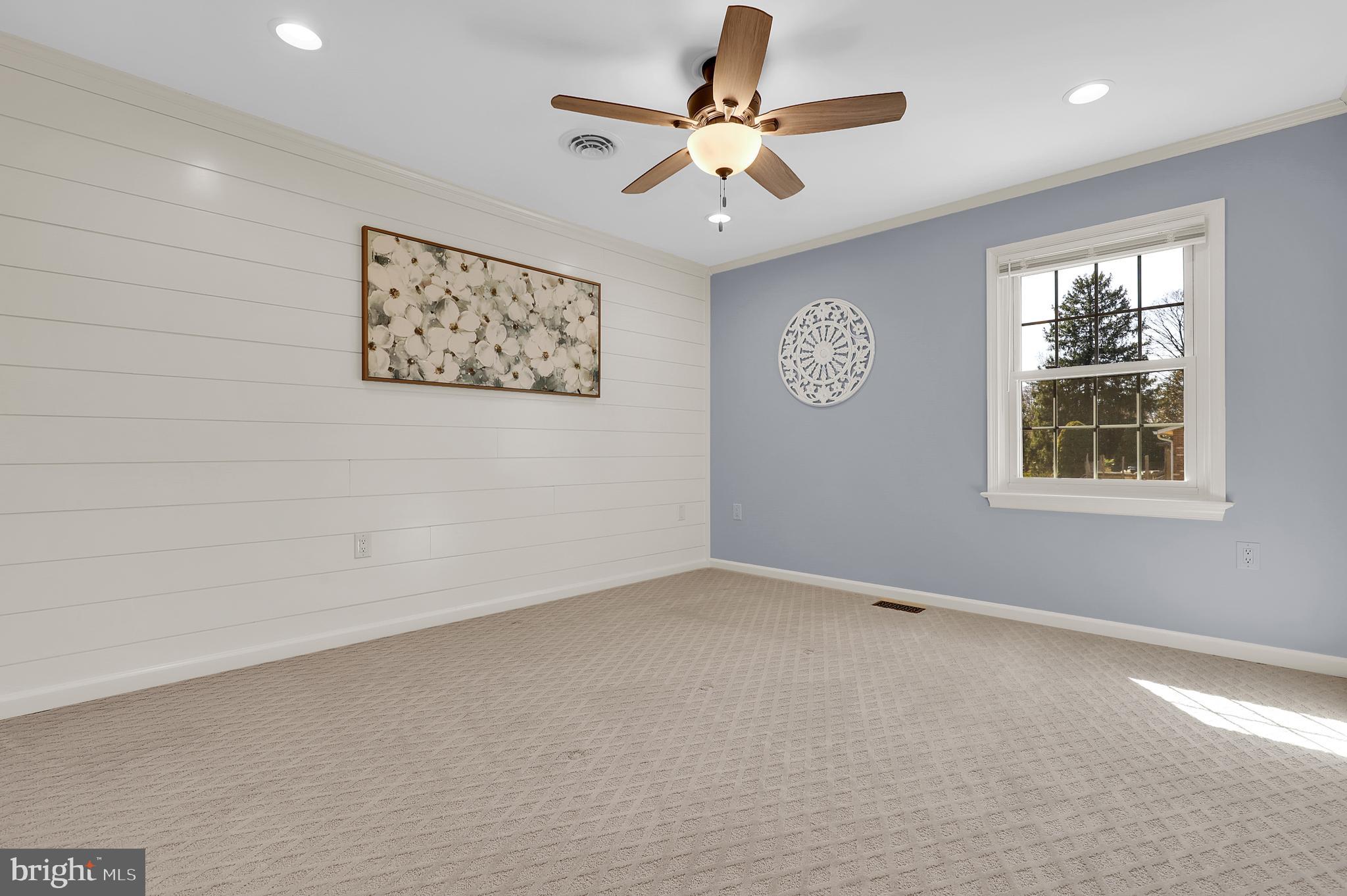 7908 River Run Court Frederick, MD 21701 - Photo 27 of 59 an empty room with windows and fan