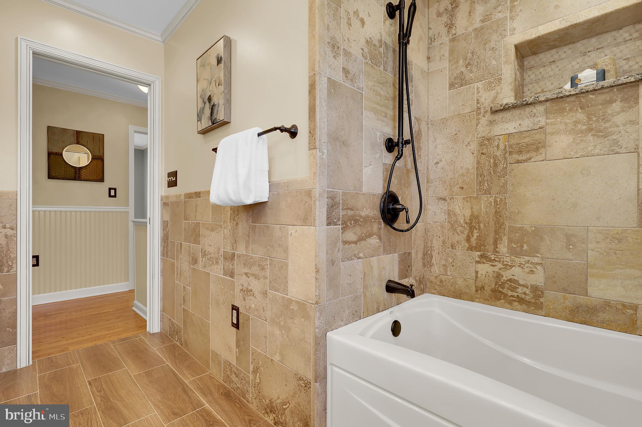 7908 River Run Court Frederick, MD 21701 - Photo 30 of 59 a bathroom with a bath tub