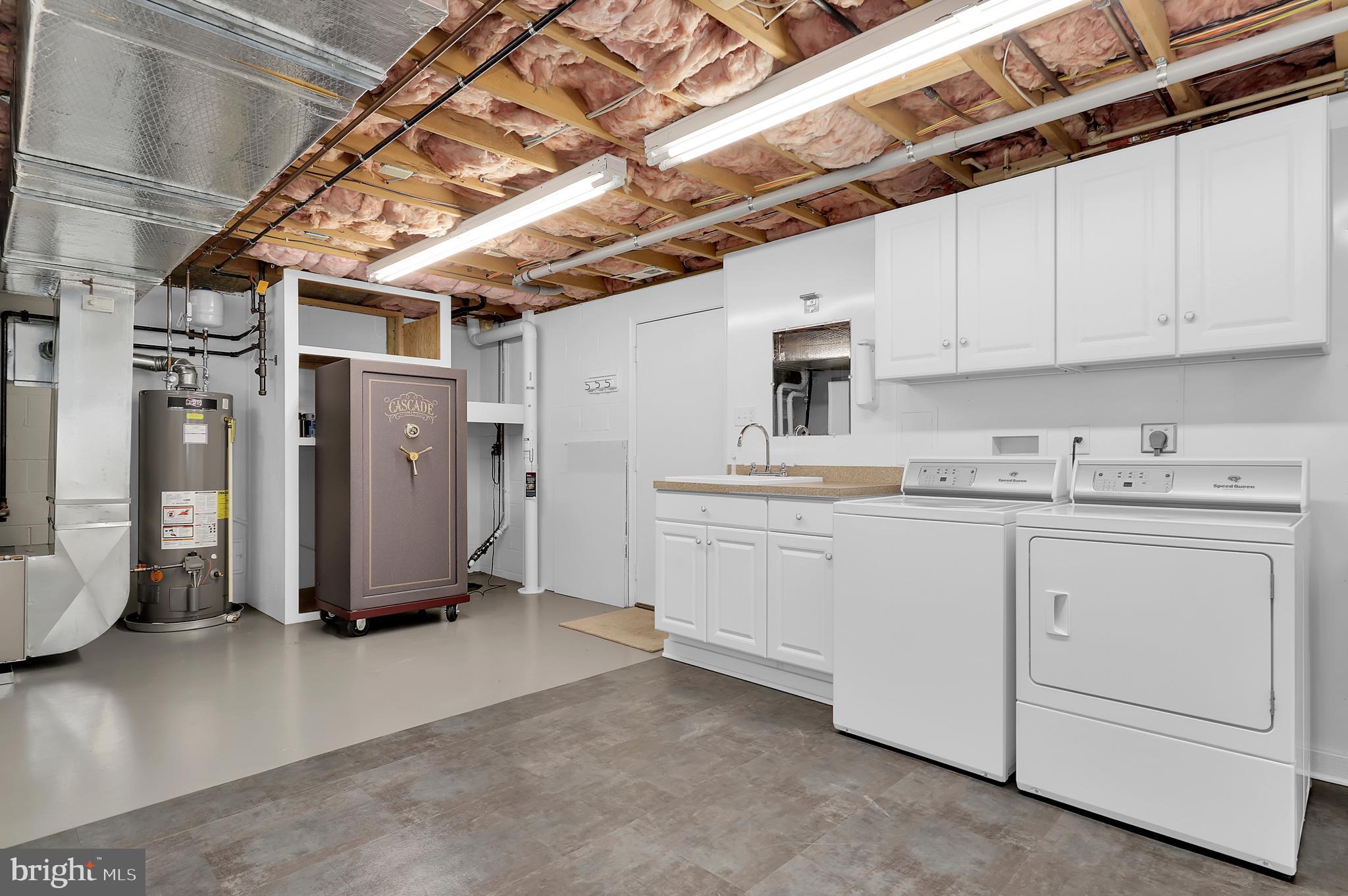7908 River Run Court Frederick, MD 21701 - Photo 35 of 59 a utility room with cabinets