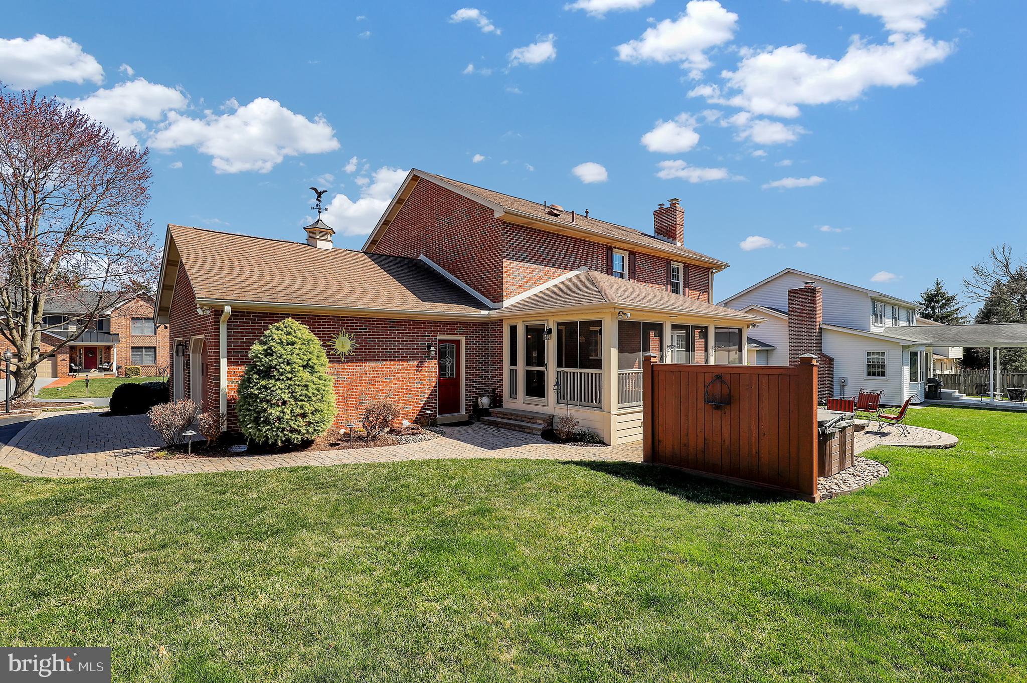 7908 River Run Court Frederick, MD 21701 - Photo 47 of 59 a front view of a house with a garden and yard