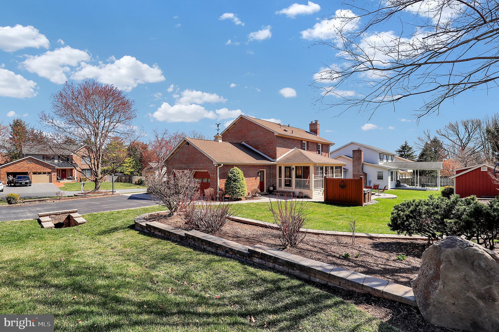 7908 River Run Court Frederick, MD 21701 - Photo 56 of 59 a front view of a house with a yard and a large tree