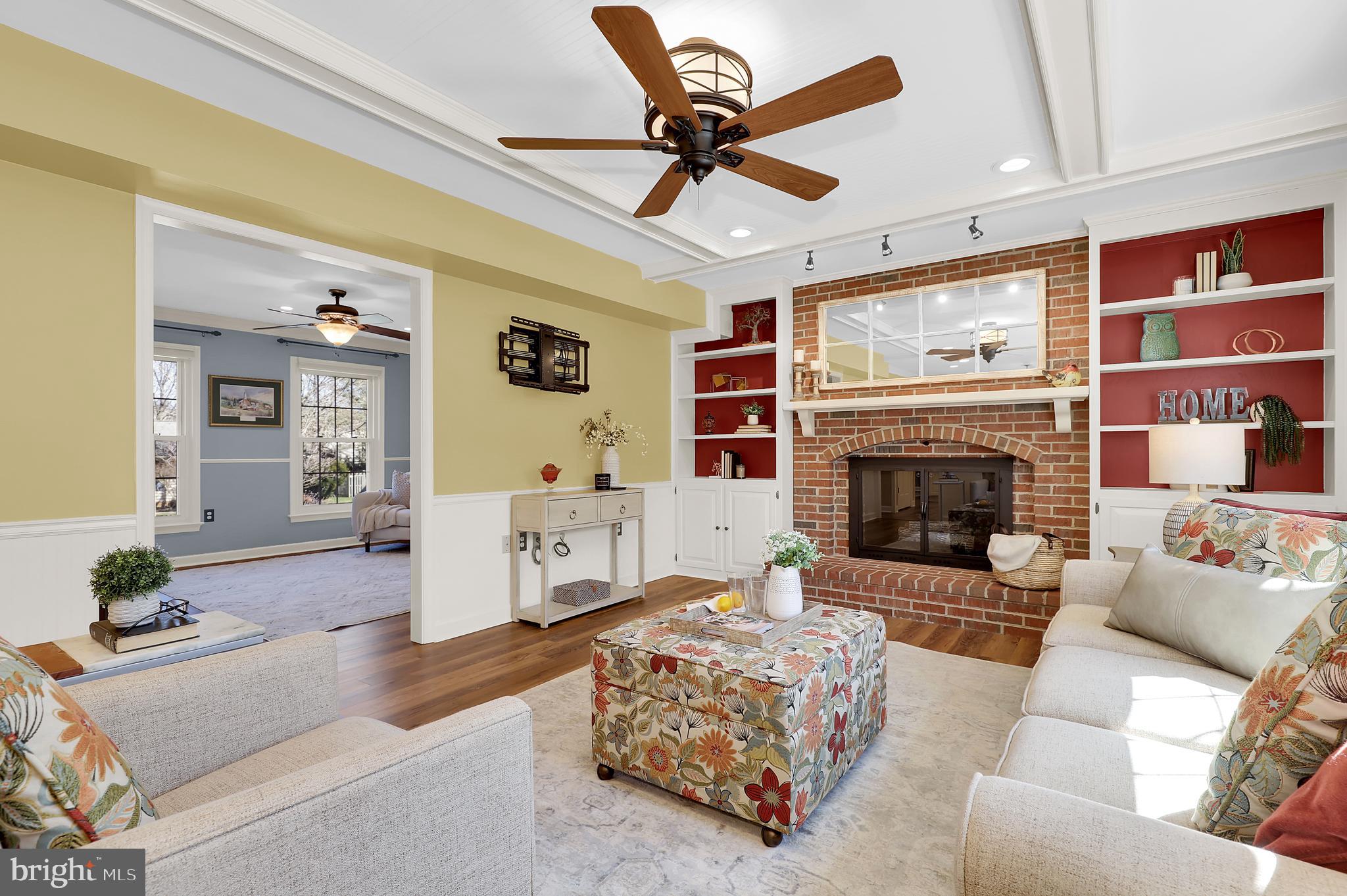 7908 River Run Court Frederick, MD 21701 - Photo 7 of 59 a living room with furniture and a fireplace
