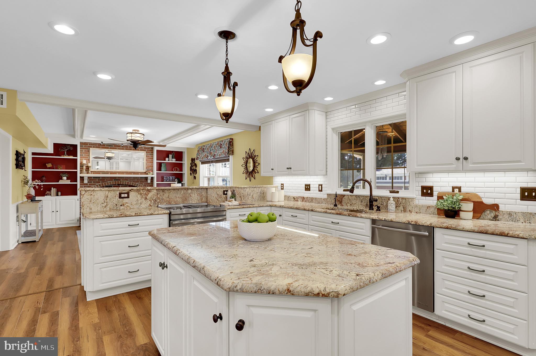 7908 River Run Court Frederick, MD 21701 - Photo 9 of 59 a kitchen with stainless steel appliances granite countertop a sink and cabinets