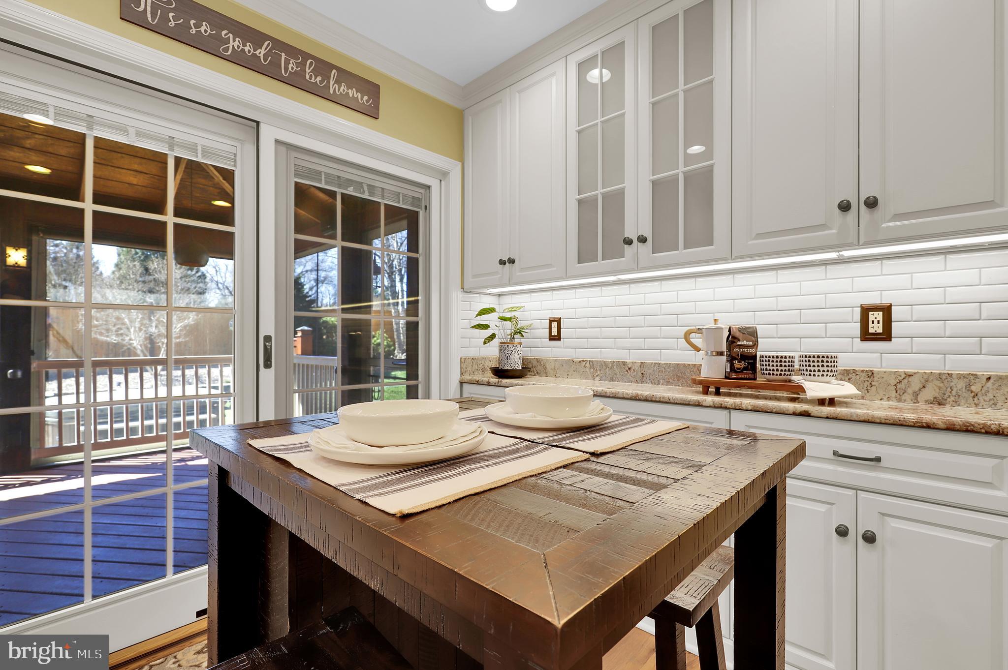 7908 River Run Court Frederick, MD 21701 - Photo 10 of 59 a kitchen with a stove a sink a refrigerator and wooden cabinets
