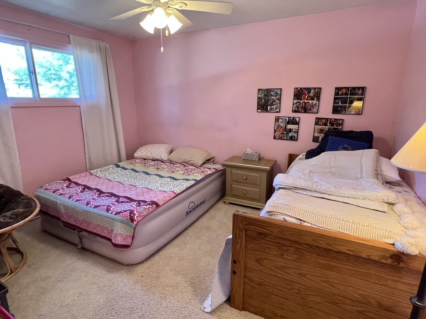 3819 Rugen Road Glenview, IL 60025 - Photo 12 of 24 a bedroom with a bed and a chandelier