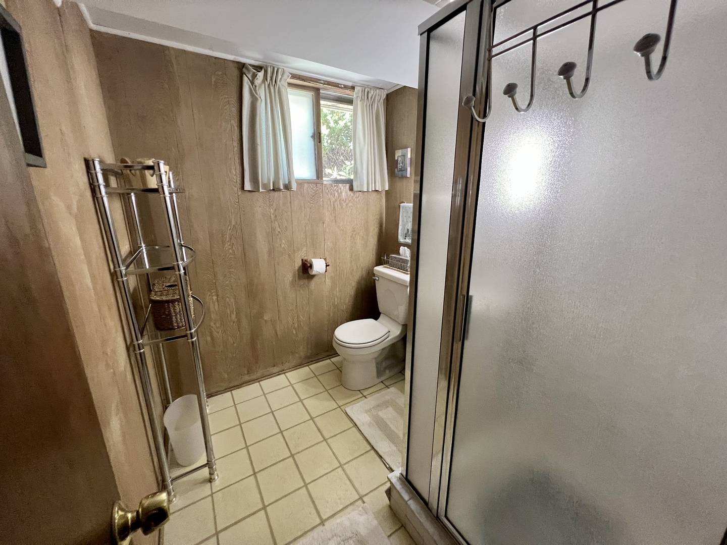3819 Rugen Road Glenview, IL 60025 - Photo 18 of 24 a bathroom with a granite countertop sink a toilet a mirror and shower