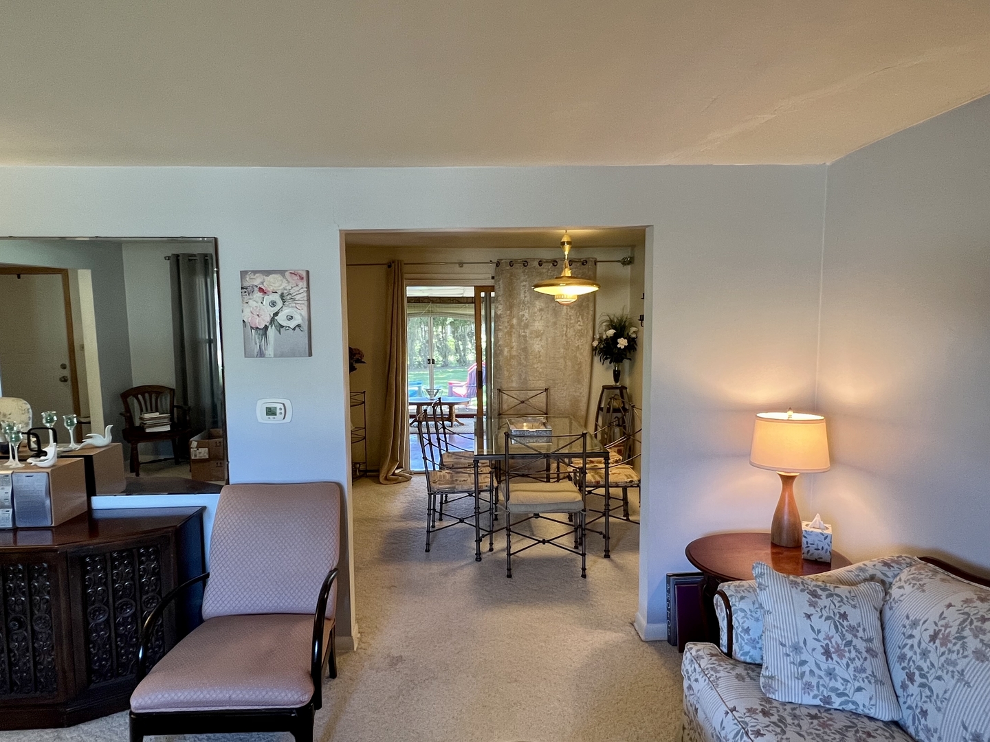 3819 Rugen Road Glenview, IL 60025 - Photo 5 of 24 a living room with furniture and a lamp
