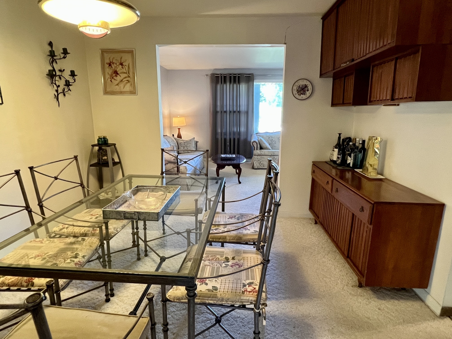 3819 Rugen Road Glenview, IL 60025 - Photo 7 of 24 a view of a dining room with furniture and a kitchen