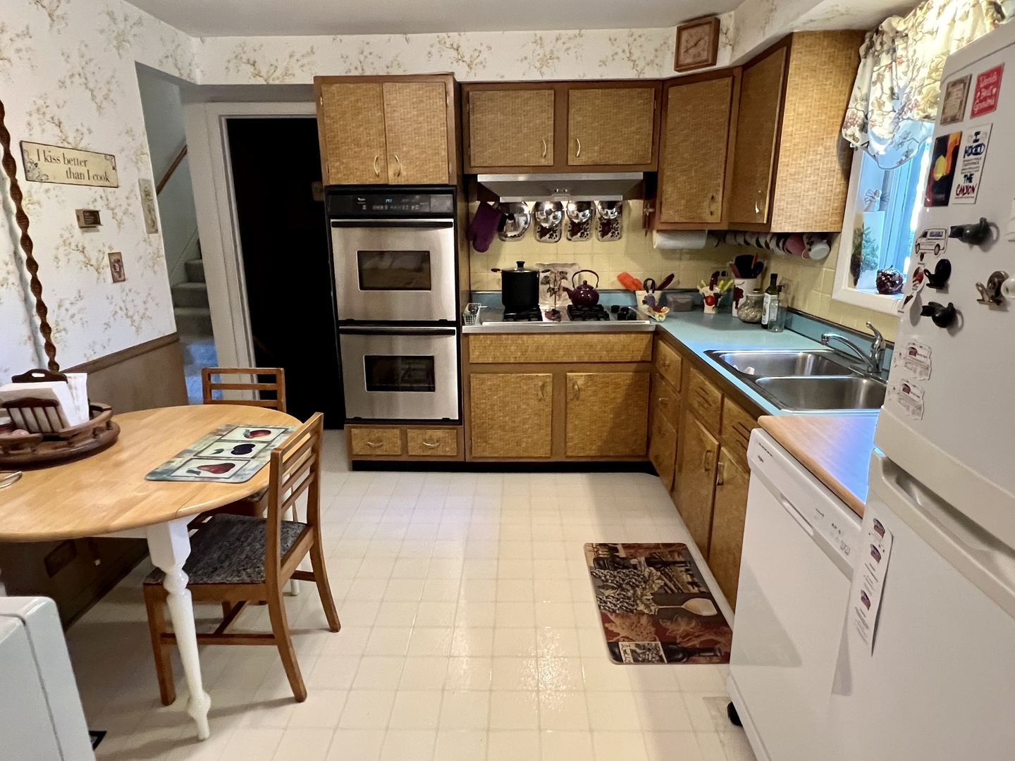3819 Rugen Road Glenview, IL 60025 - Photo 10 of 24 a kitchen with stainless steel appliances kitchen island granite countertop a sink and cabinets