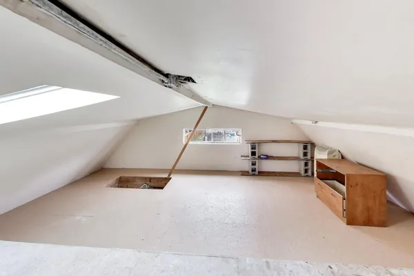 a view of an empty room with windows