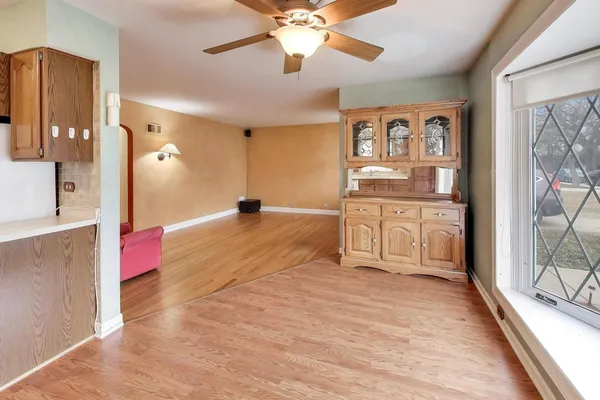 a spacious bathroom with stainless steel appliances vanity and a mirror