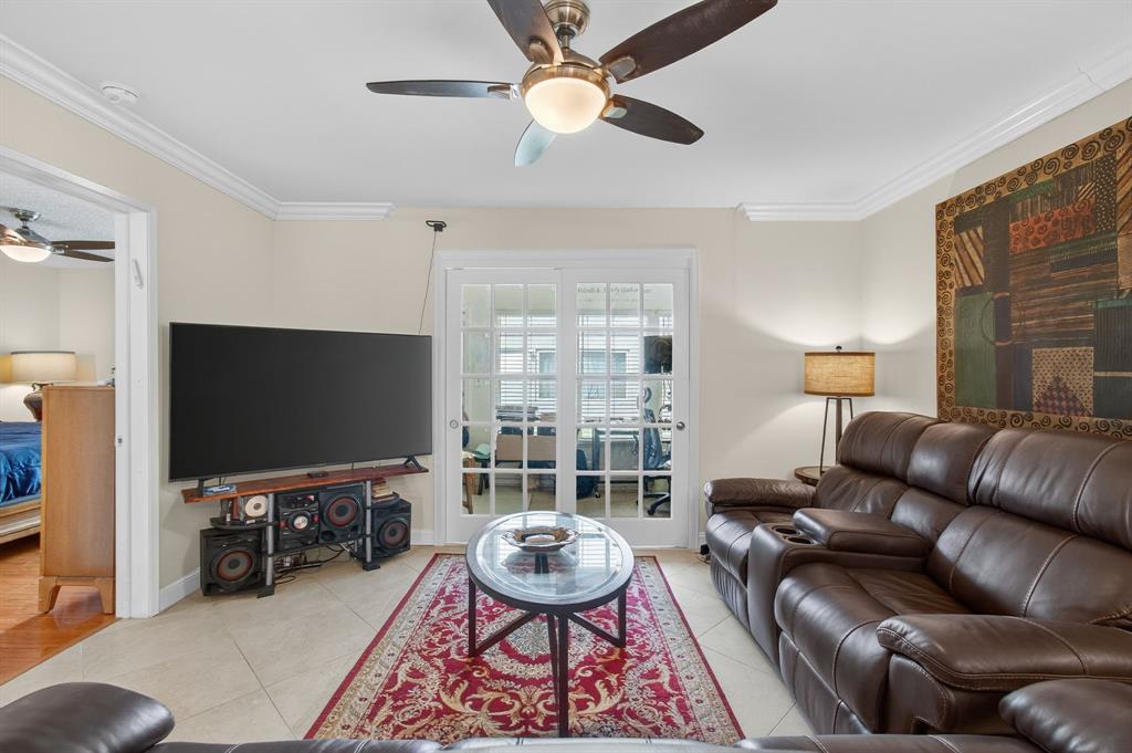 19000 Stewart Circle, Unit 4 Boca Raton, FL 33496 - Photo 20 of 63 a living room with furniture and a flat screen tv