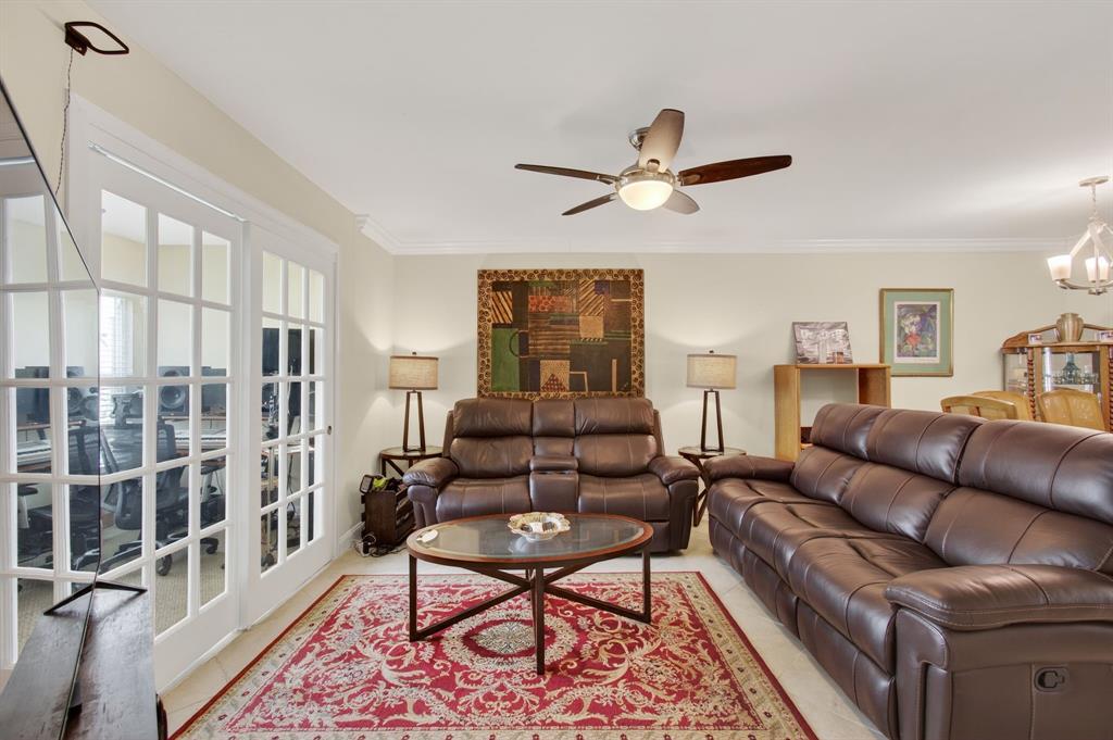19000 Stewart Circle, Unit 4 Boca Raton, FL 33496 - Photo 22 of 63 a living room with furniture a ceiling fan and a rug