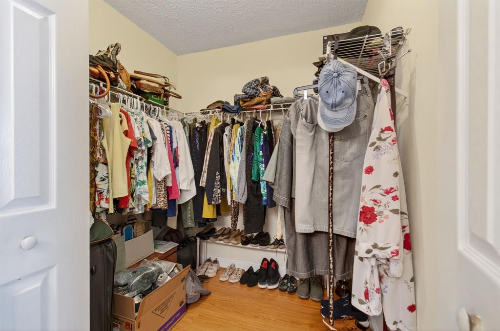19000 Stewart Circle, Unit 4 Boca Raton, FL 33496 - Photo 37 of 63 a view of walk in closet with clothes and shoes