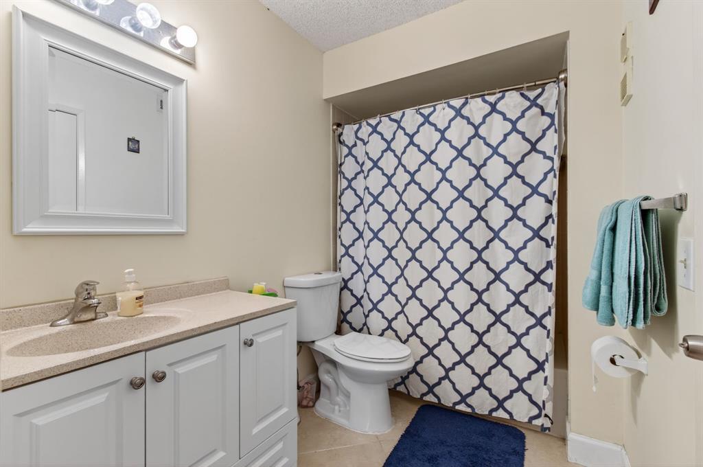 19000 Stewart Circle, Unit 4 Boca Raton, FL 33496 - Photo 43 of 63 a bathroom with a sink and a toilet