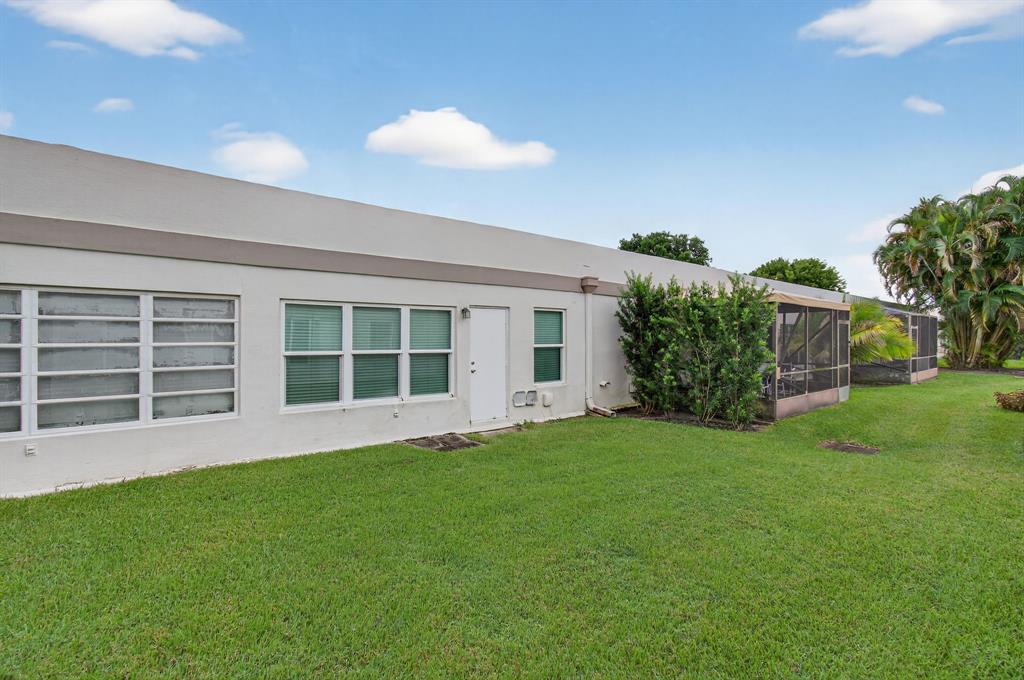 19000 Stewart Circle, Unit 4 Boca Raton, FL 33496 - Photo 46 of 63 a view of house with backyard space and garden