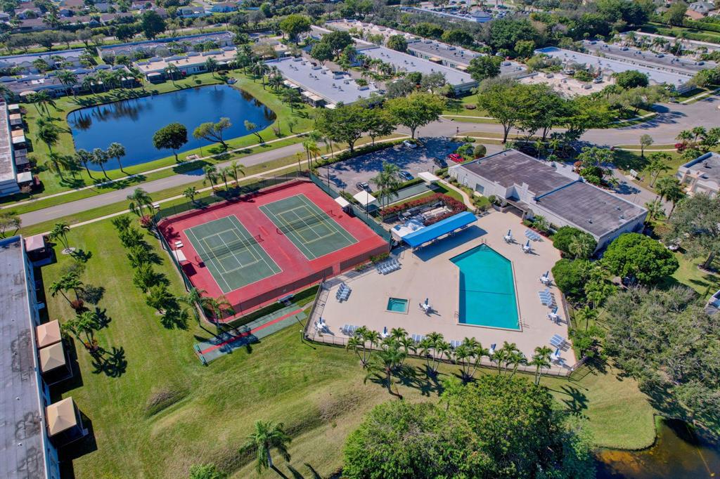 19000 Stewart Circle, Unit 4 Boca Raton, FL 33496 - Photo 53 of 63 an aerial view of a tennis ground and a cars park side of the road