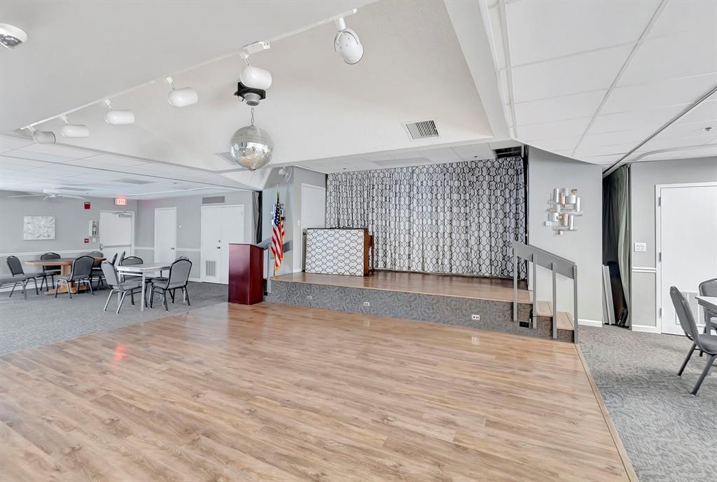 19000 Stewart Circle, Unit 4 Boca Raton, FL 33496 - Photo 57 of 63 a living room with furniture and a chandelier