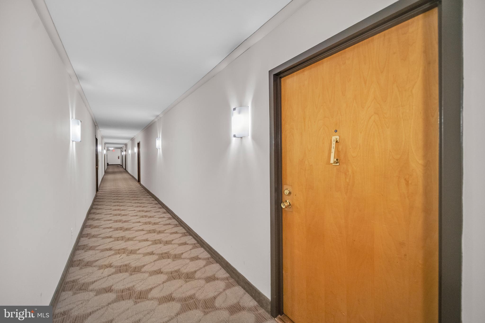 1245 13th Street Northwest, Unit 915 Washington, DC 20005 - Photo 5 of 22 a view of a hallway with wooden floor and a window