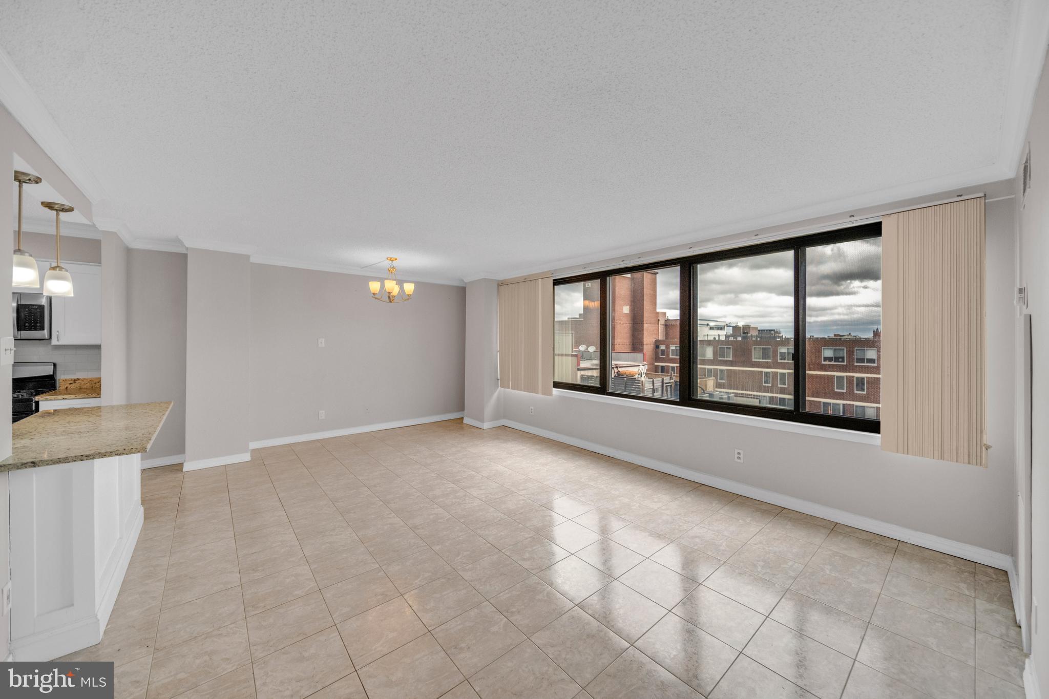 1245 13th Street Northwest, Unit 915 Washington, DC 20005 - Photo 6 of 22 a view of an empty room with a window