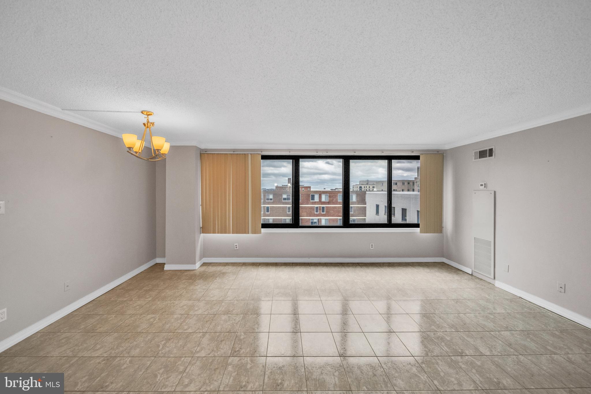 1245 13th Street Northwest, Unit 915 Washington, DC 20005 - Photo 10 of 22 a view of an empty room with window