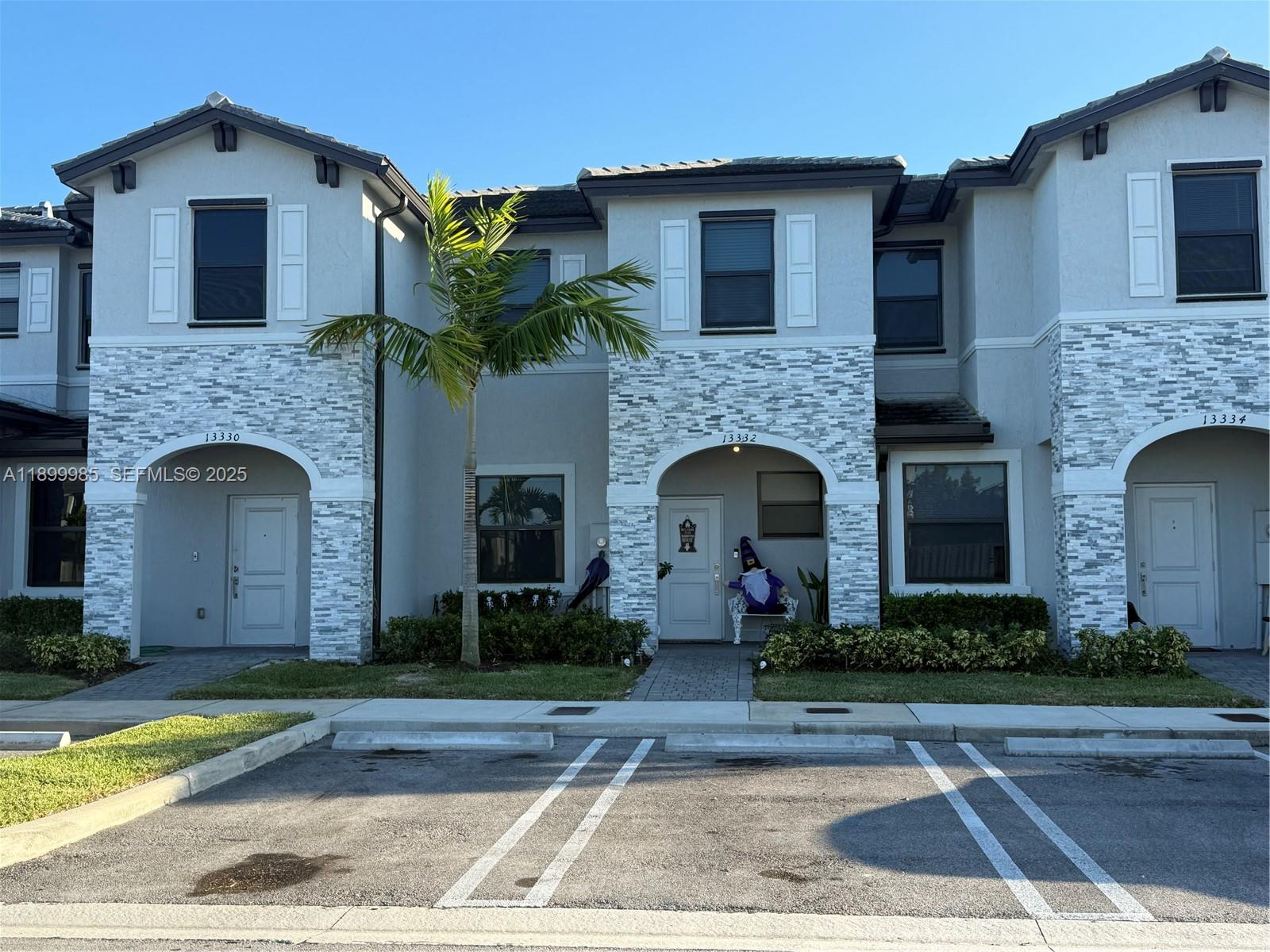 13322 Southwest 287th Terrace Homestead, FL 33033 - Photo 4 of 9 a front view of a house with plants