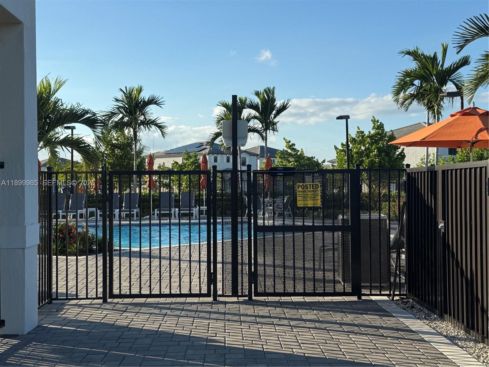 13322 Southwest 287th Terrace Homestead, FL 33033 - Photo 5 of 9 a view of a balcony with a potted plants