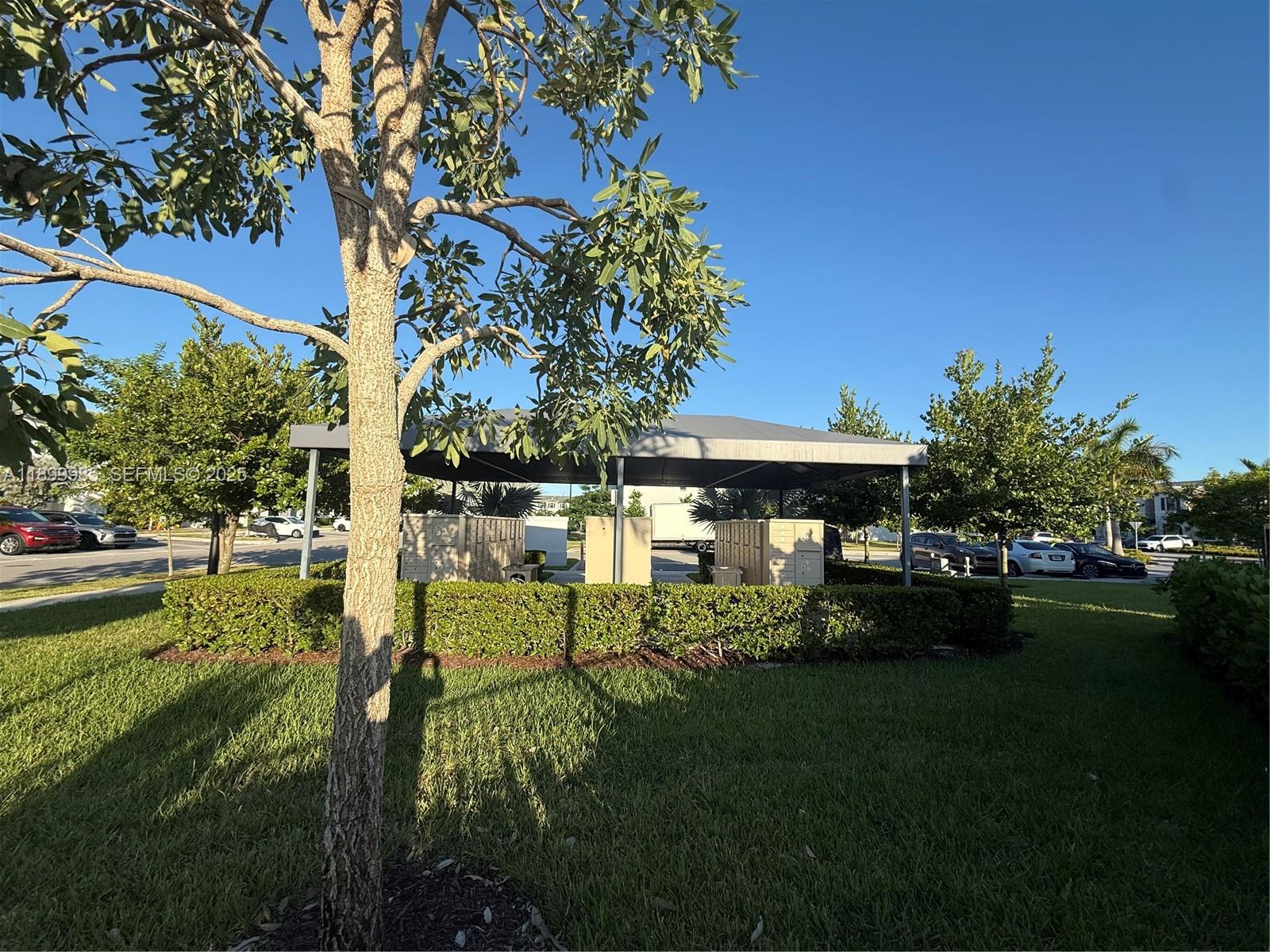 13322 Southwest 287th Terrace Homestead, FL 33033 - Photo 7 of 9 a garden view with a seating space