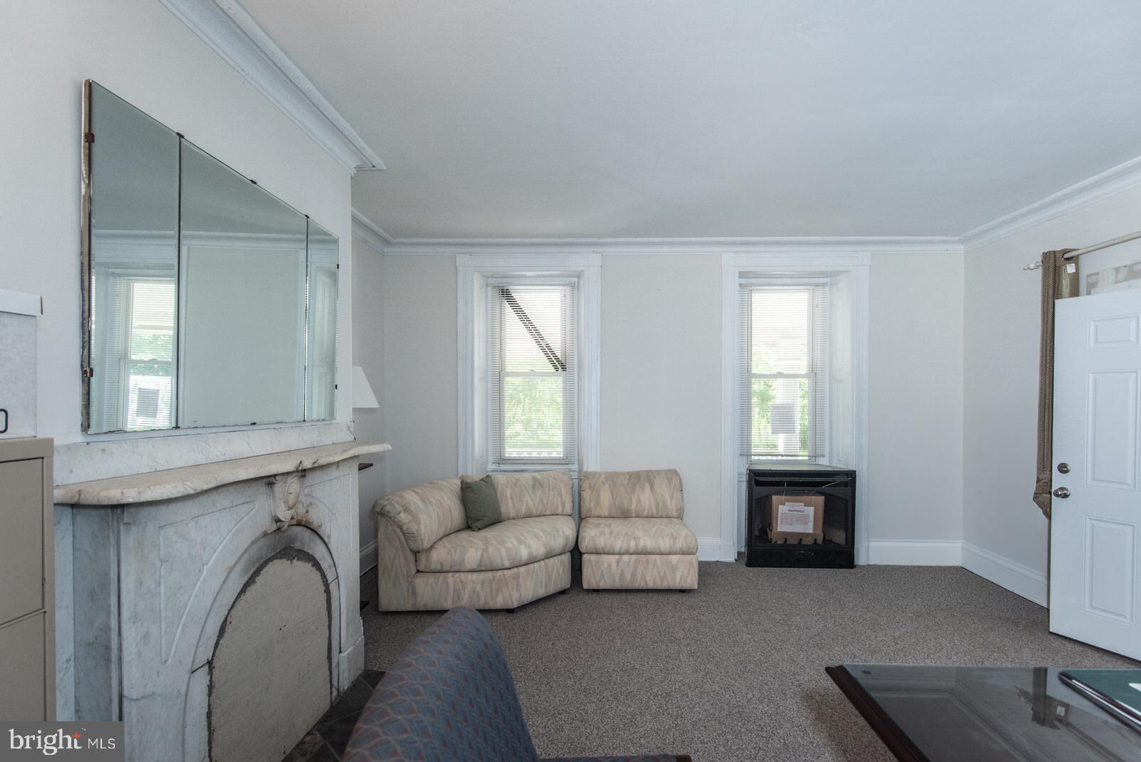 169 State Rd. Bensalem, PA 19020 - Photo 41 of 100 a living room with furniture and a fireplace