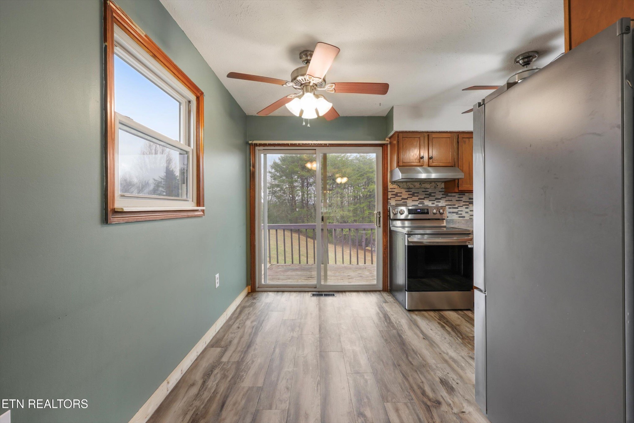 47 Paint Rock Ferry Road Kingston, TN 37763 - Photo 6 of 38 wooden floor in an empty room with a window