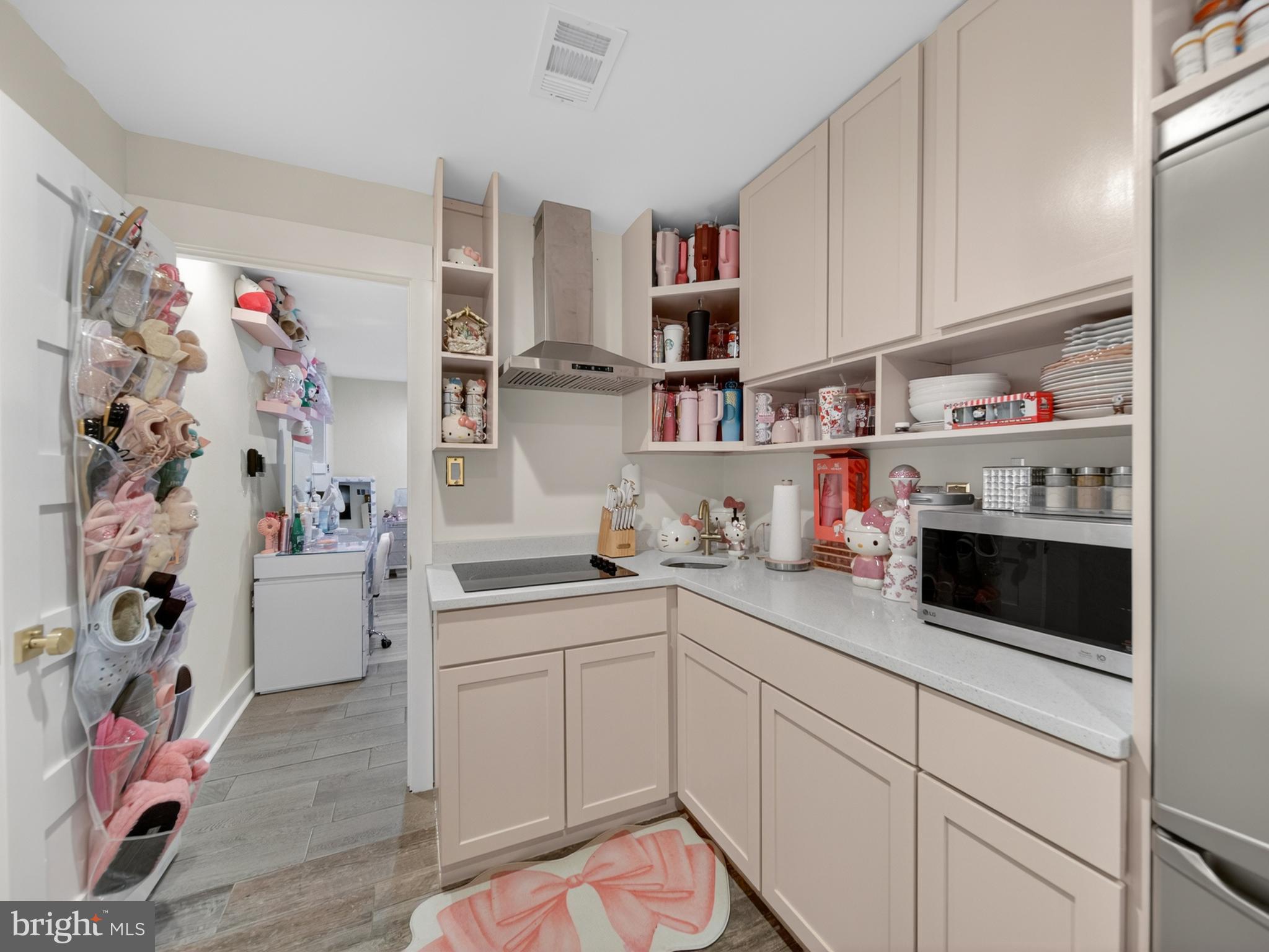 13427 Delaney Road Woodbridge, VA 22193 - Photo 42 of 57 a kitchen with a white cabinets and window
