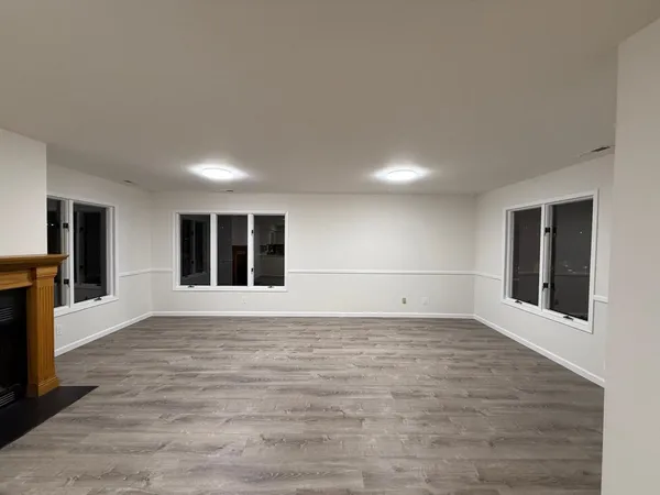 a kitchen with a refrigerator and a stove top oven
