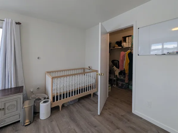 a bedroom with a workspace