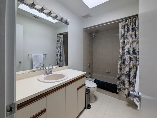 a kitchen with a sink and a refrigerator
