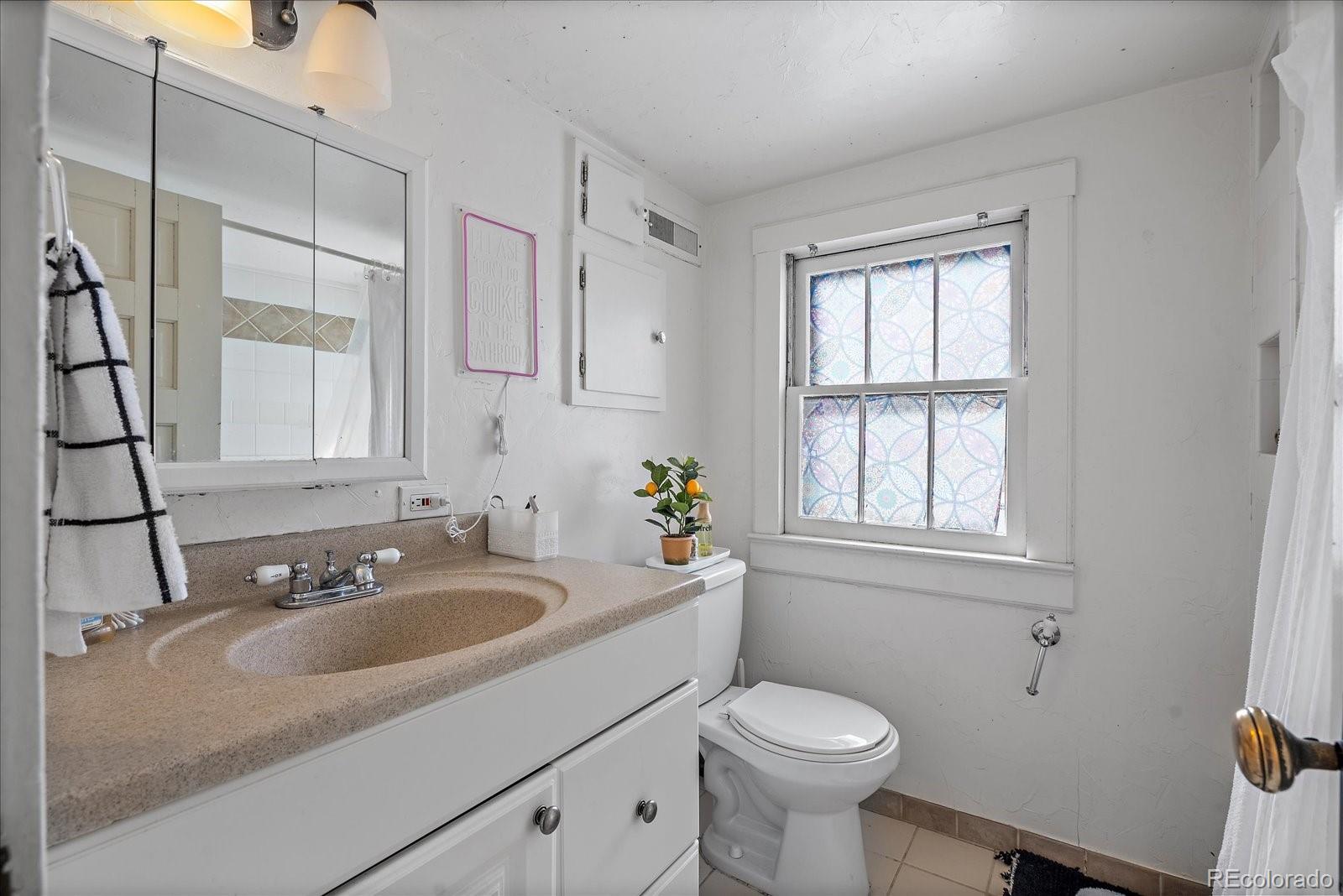 2002 Baseline Road Boulder, CO 80302 - Photo 14 of 31 a bathroom with a sink toilet and window