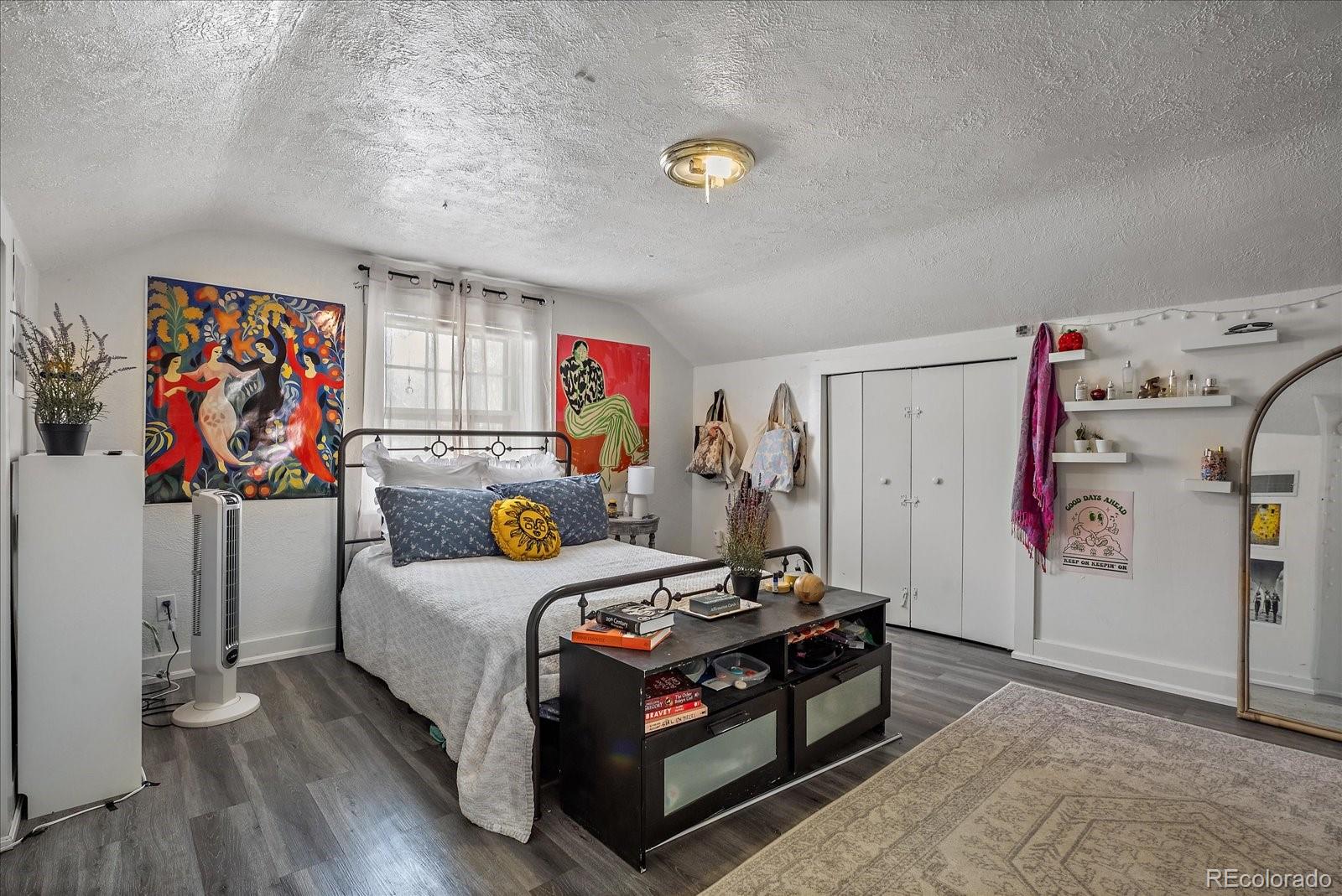 2002 Baseline Road Boulder, CO 80302 - Photo 16 of 31 a bed room with a bed and a couch