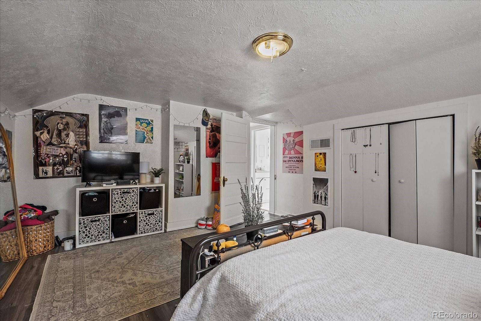 2002 Baseline Road Boulder, CO 80302 - Photo 17 of 31 a bed room with a bed and a television
