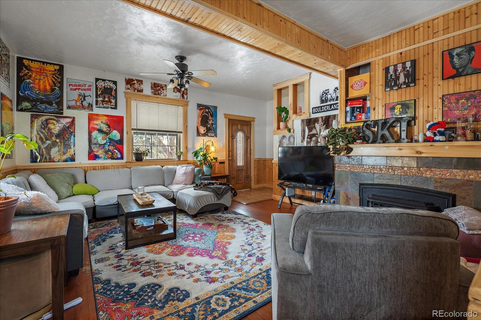 2002 Baseline Road Boulder, CO 80302 - Photo 5 of 31 a living room with furniture fireplace and rug