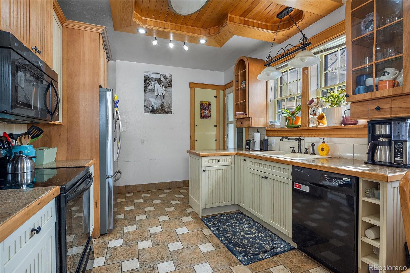 2002 Baseline Road Boulder, CO 80302 - Photo 8 of 31 a kitchen with a sink stove and cabinets