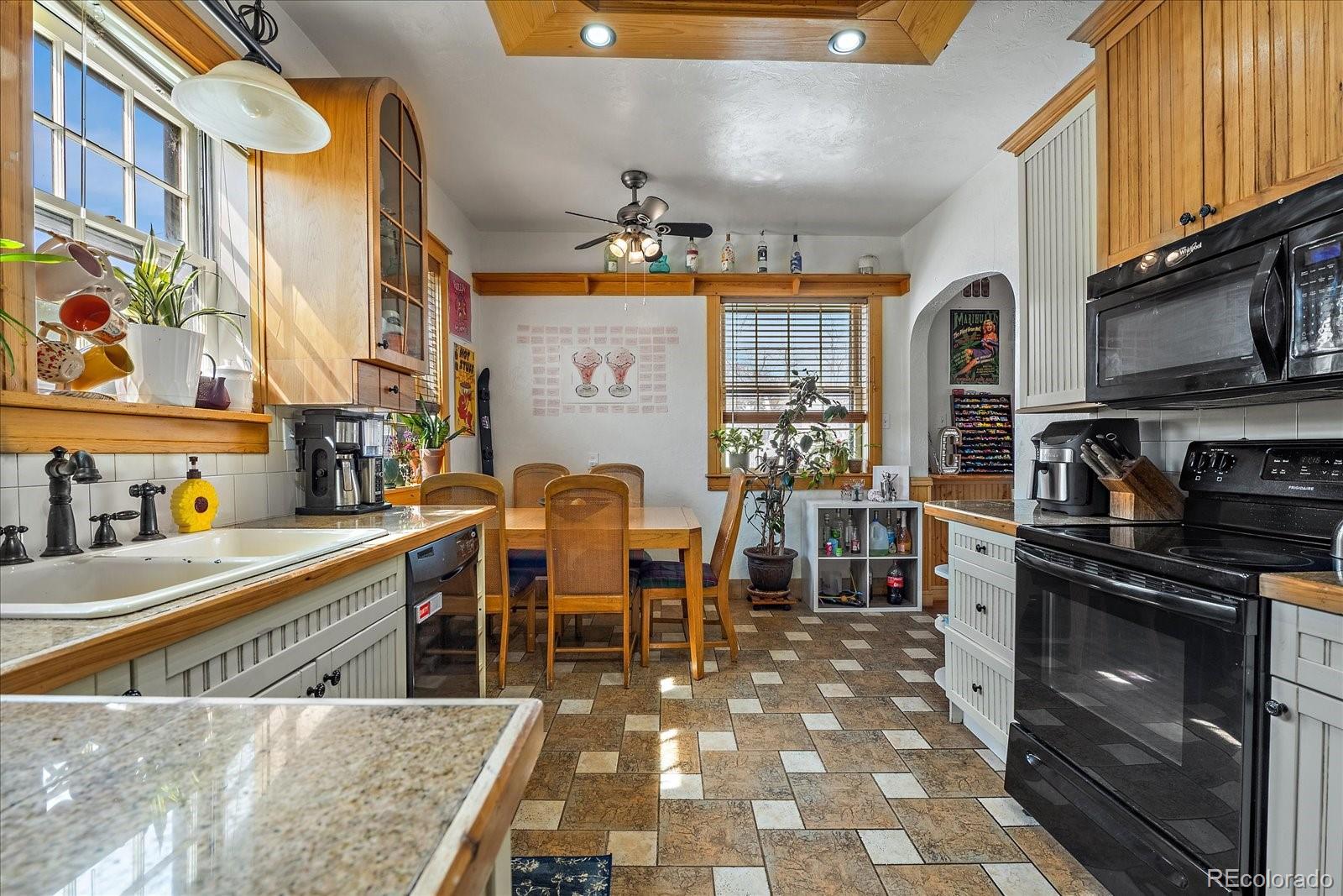 2002 Baseline Road Boulder, CO 80302 - Photo 9 of 31 a kitchen with stainless steel appliances granite countertop a sink and a refrigerator